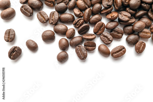 Roasted coffee beans isolated on white background. Close-up.