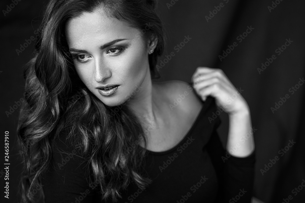 Close-up photo of beautiful young brunette woman in a lingerie, fashion beauty portrait on a dark background Close-up photo of beautiful young brunette woman in a lingerie, fashion beauty portrait on a dark background