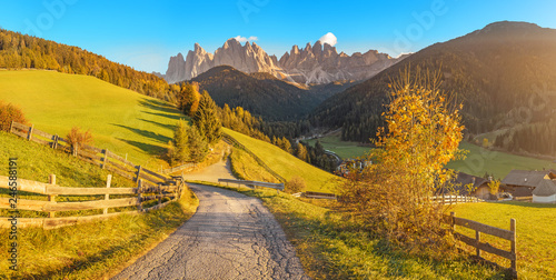 Funes Valley landscape during autumn in Santa Magdalena village with Odle mountain range on the background. Travel in Italian Dolomites concept