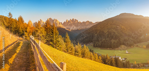 Funes Valley landscape during autumn in Santa Magdalena village with Odle mountain range on the background. Travel in Italian Dolomites concept