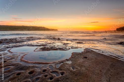 Sunrise from the Sydney Coast with foregrund rock pools