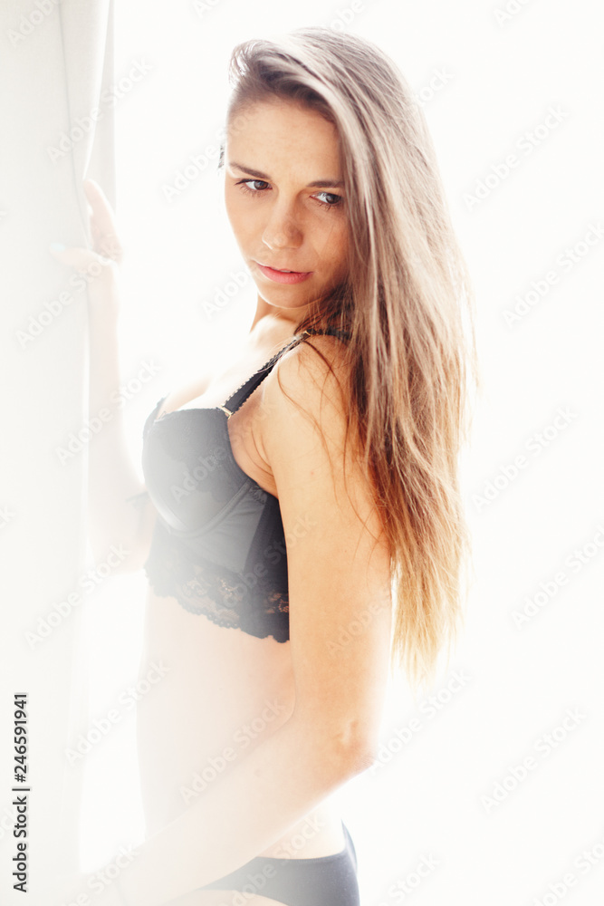 Cute brunette girl posing at home loft studio Cute brunette girl posing at home loft studio