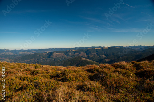 Panoramic view of idyllic mountain scenery in sunny day