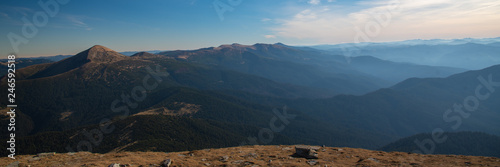 Panoramic view of idyllic mountain scenery in sunny day