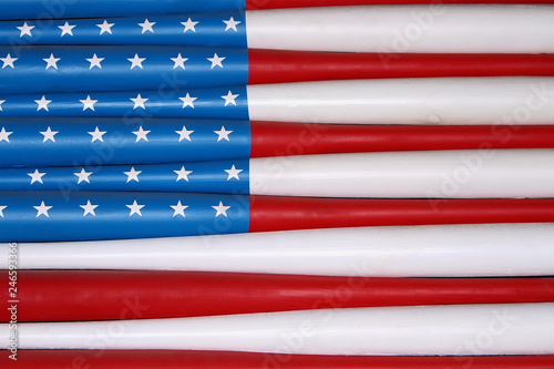 Canvas Print flag of usa on baseball bats on wall. Texture, background