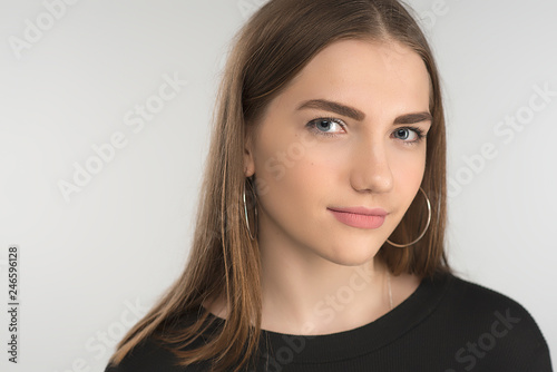 Closeup face portrait of smiling blonde young woman with natural makeup. - Horizontal image