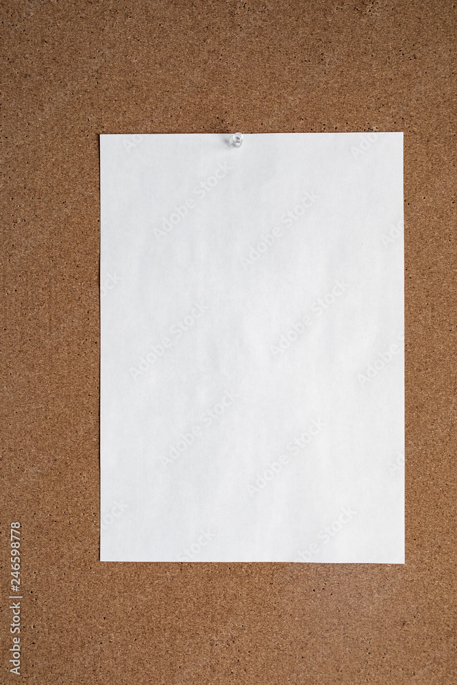 Horizontal cork board with many, sticky notes pinned Horizontal cork board with many, sticky notes pinned