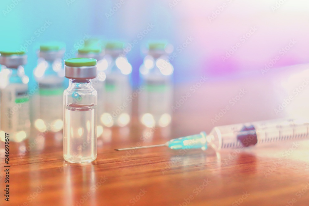 Vaccine vial dose flu shot drug needle syringe,medical concept vaccination hypodermic injection treatment disease care hospital prevention immunization illness disease baby child. influenza vaccine. Vaccine vial dose flu shot drug needle syringe,medical concept vaccination hypodermic injection treatment disease care hospital prevention immunization illness disease baby child. influenza vaccine.