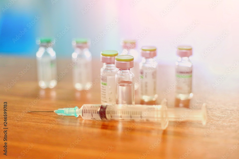 Vaccine vial dose flu shot drug needle syringe,medical concept vaccination hypodermic injection treatment disease care hospital prevention immunization illness disease baby child. influenza vaccine. Vaccine vial dose flu shot drug needle syringe,medical concept vaccination hypodermic injection treatment disease care hospital prevention immunization illness disease baby child. influenza vaccine.