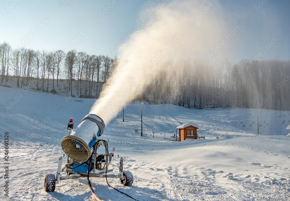 Snow gun machine producing fresh snow.