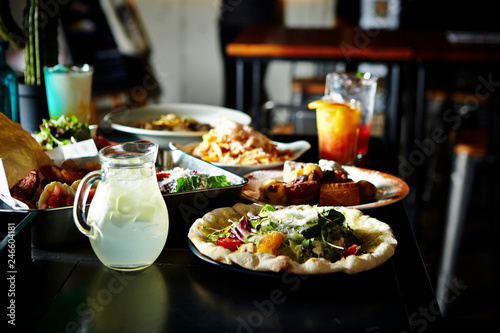 Salad pizza with drinks