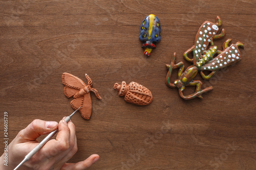 creative ceramist makes products of white and red clay