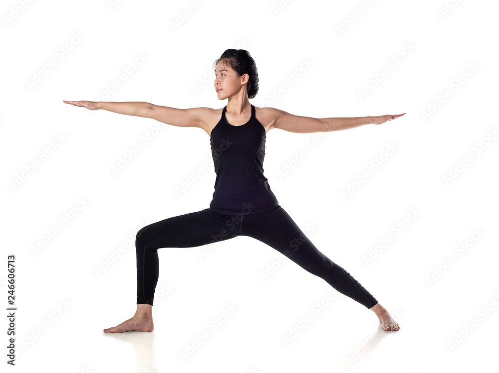 Beautiful fitness model practices yoga or pilates, doing lunge exercise, standing in Warrior II posture, Virabhadrasana 2, side view, studio shot, isolated on white background, with clipping path 