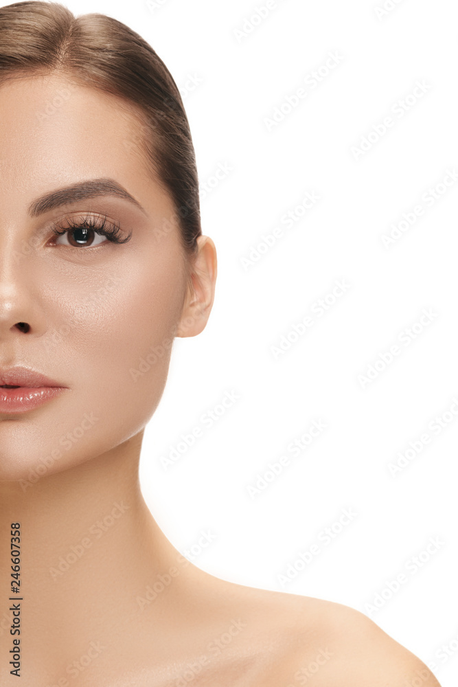 The beautiful female face. The perfect and clean skin of face on white. The beauty, care, skin, treatment, health, spa, cosmetic concept The beautiful female face. The perfect and clean skin of face on white. The beauty, care, skin, treatment, health, spa, cosmetic concept