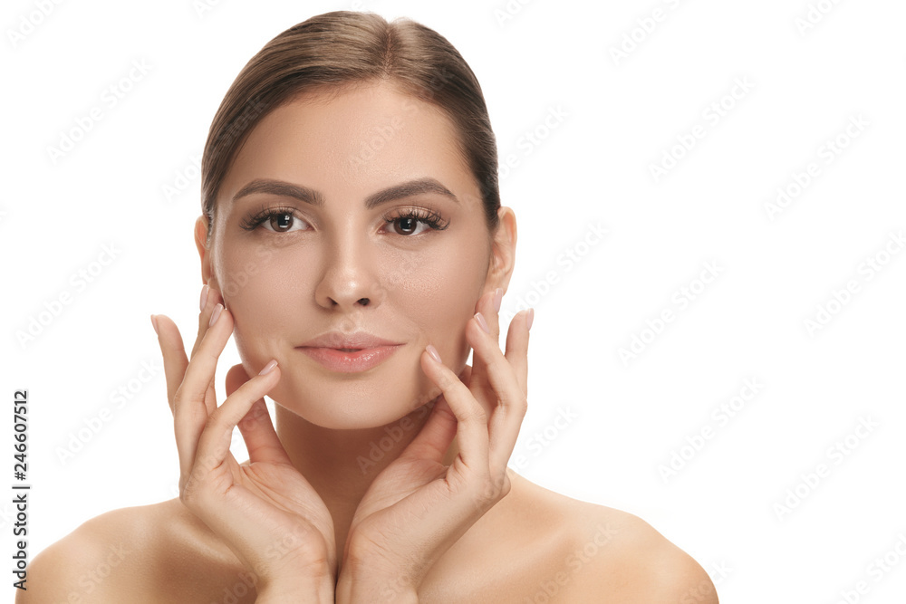 The beautiful female face. The perfect and clean skin of face on white. The beauty, care, skin, treatment, health, spa, cosmetic concept