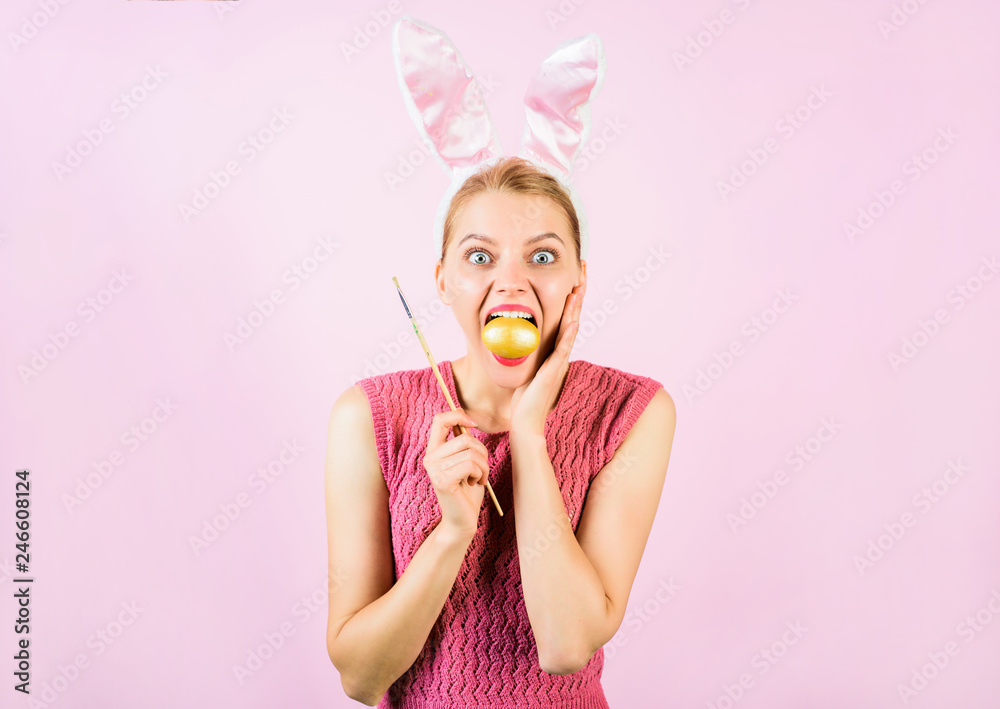 Easter egg ideas. Egg hunt. Easter rabbit. Bunny ears. Woman with bunny ears. Painting eggs. Happy woman in bunny costume painting easter egg. Woman holds egg in mouth. Spring holiday. Easter symbol. Easter egg ideas. Egg hunt. Easter rabbit. Bunny ears. Woman with bunny ears. Painting eggs. Happy woman in bunny costume painting easter egg. Woman holds egg in mouth. Spring holiday. Easter symbol.