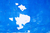 Peeled blue paint from a wall.