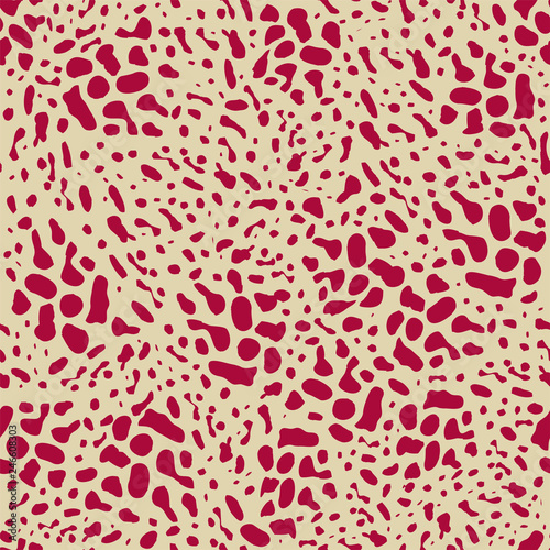 Red animal skin leopard pattern on beige background. Seamless background with random black elements. Abstract ornament.