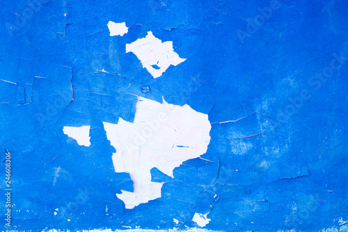 Fototapeta Naklejka Na Ścianę i Meble -  Peeled blue paint from a wall.