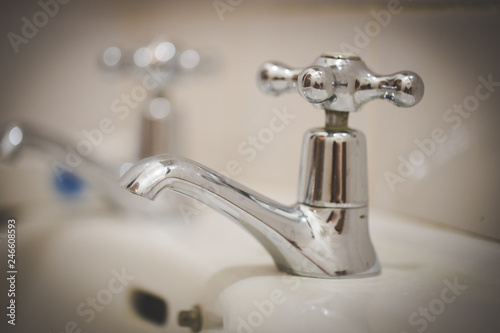 Close up image of a vintage tap in a bathroom