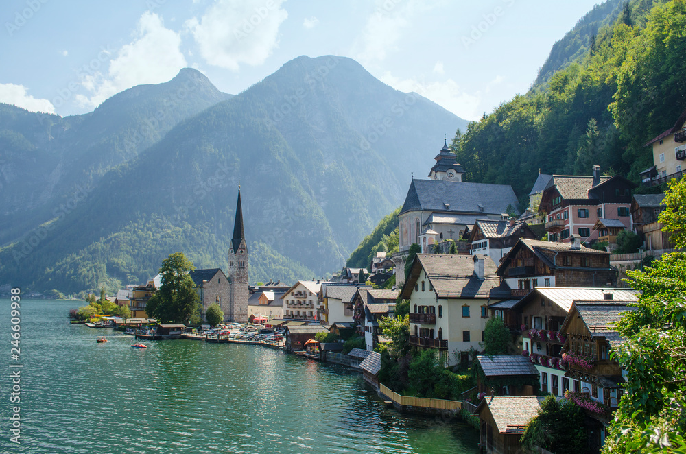 Classic postcard view of famous Hallstatt lakeside town in the Alps on a beautiful sunny day in summer, Salzkammergut region, Austria