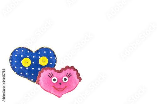 small soft homemade toy in the form of a heart for Valentine's Day on a white isolated background