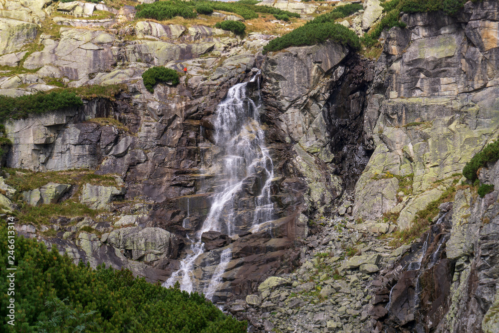 Waterfall jump in Mlynicka Valley. High Tatras. Slovakia.