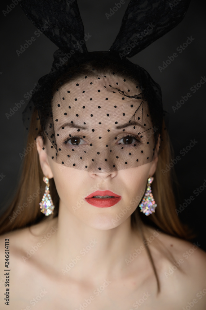 Portrait of beautiful sensual woman with veil and bunny ears. Portrait of beautiful sensual woman with veil and bunny ears.