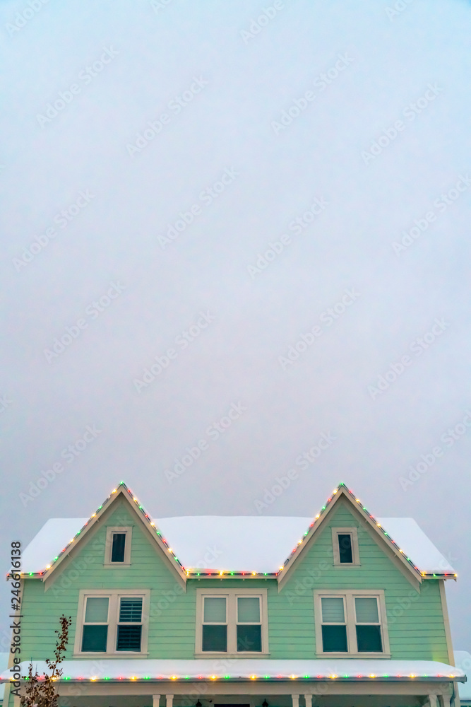 Sky over a festive snowy home in Daybreak Utah