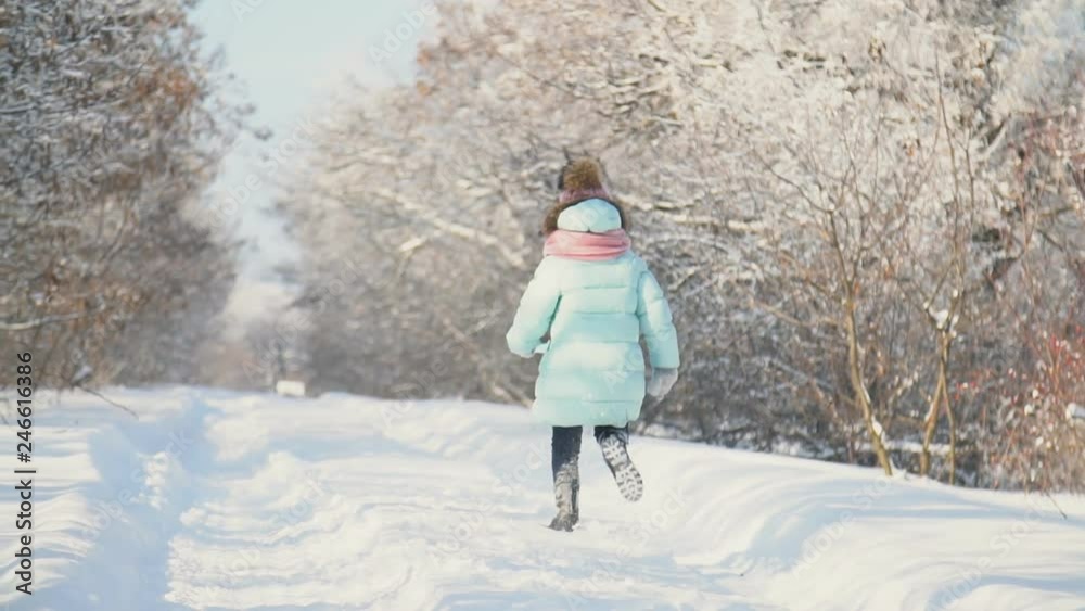 little girl runs on a snowy road little girl runs on a snowy road