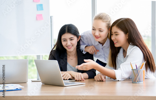 Foreign women entrepreneurs are coaching, strategically working through the laptop. Marketing Plan in the Digital World 4.0-5.0. Work that is understandable and quick will make a business successful.