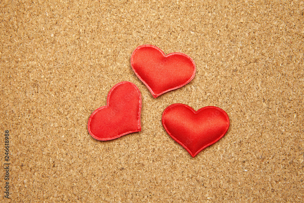 A few hearts on a corkboard, the concept of strong love