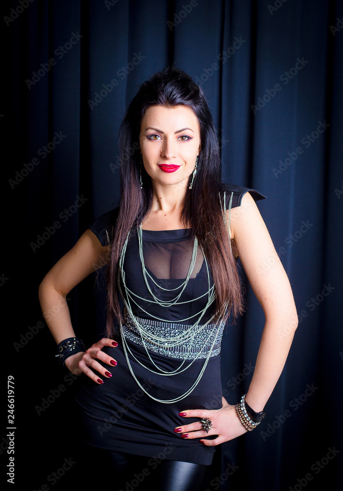 Sexy punk girl. Beautiful girl in rock style with elegant breasts on a dark  background Stock Photo | Adobe Stock