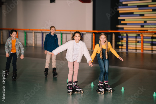 Excited kids in roller skates training together