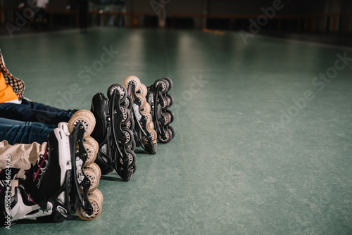 Cropped view of kids wears roller skates
