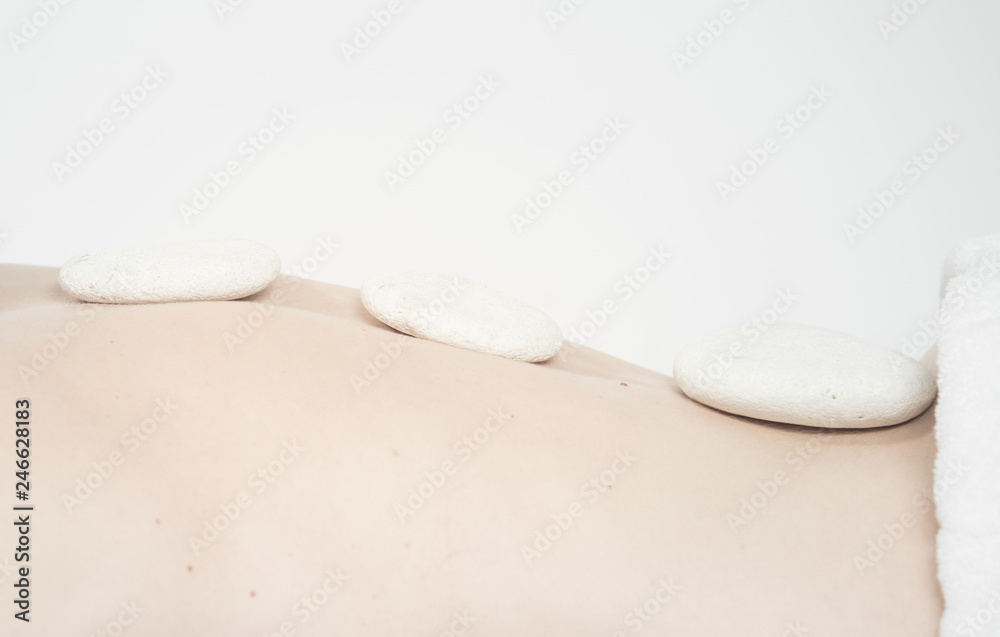 Hot stone massage therapy at beauty center Hot stone massage therapy at beauty center
