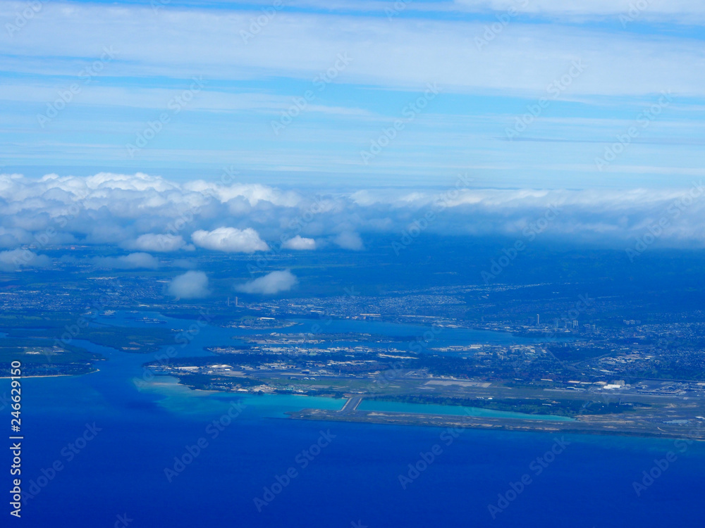 Aerial of Honolulu International Airport Coral Runway, Pearl Harbor, and City