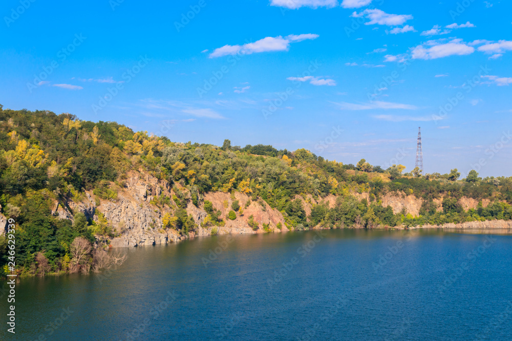 View of the lake at abandoned quarry on summer