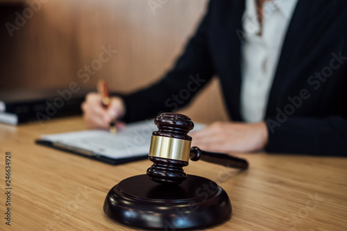 Judge gavel with Justice lawyers, Businesswoman in suit or lawyer working on a documents. Legal law, advice and justice concept