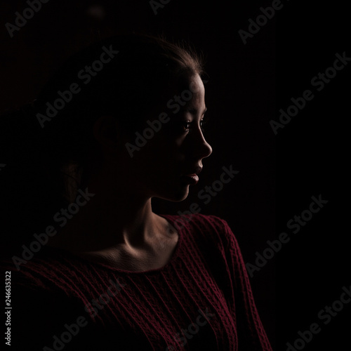 female silhouette isolated on black background