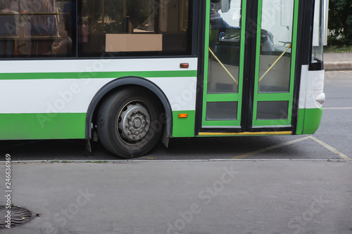  city bus goes along street.