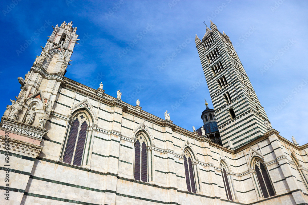 Metropolitan Cathedral of Saint Mary of the Assumption and bell tower in Siena, Tuscany, italy at the winter morning