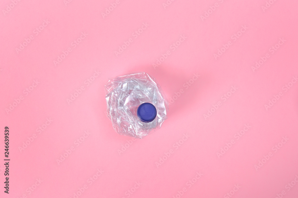 deformed plastic bottle on pink background deformed plastic bottle on pink background