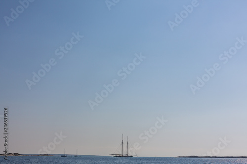 Sail boat in open sea on the horizon. Copyspace © Bryukhanova