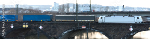 cargo train speeding on a bridge