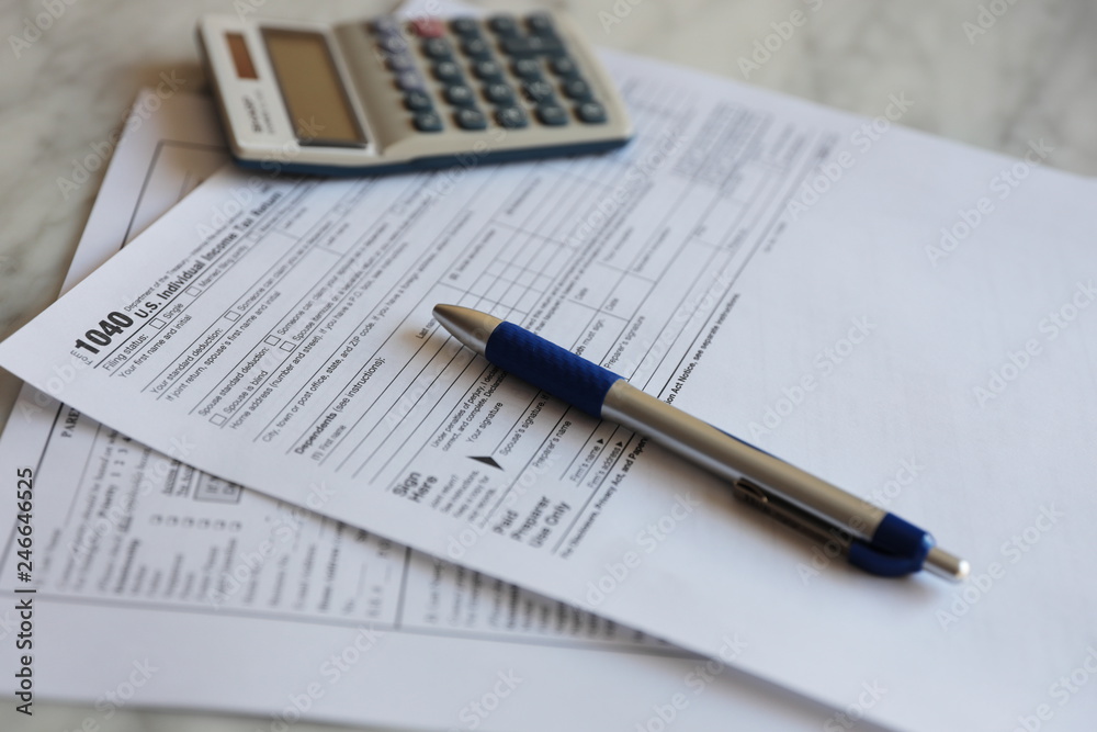 Tax Forms calculator pen paper finance business Tax Forms calculator pen paper finance business
