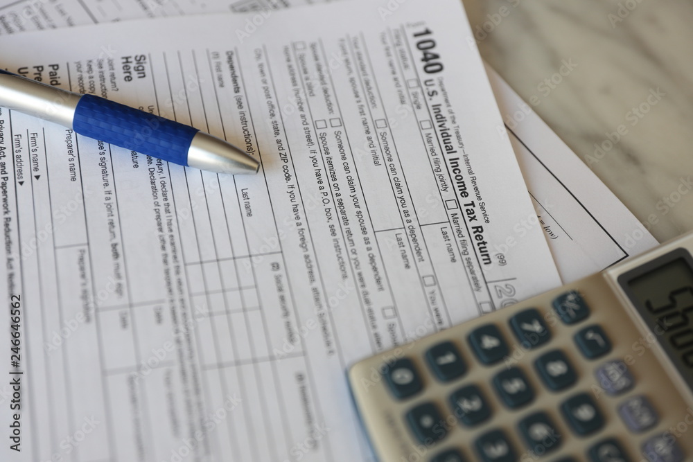 Tax Forms calculator pen paper finance business Tax Forms calculator pen paper finance business