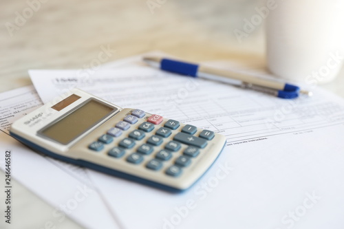 Tax Forms calculator pen paper finance business 