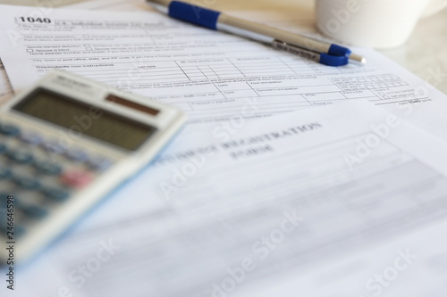 Tax Forms calculator pen paper finance business 