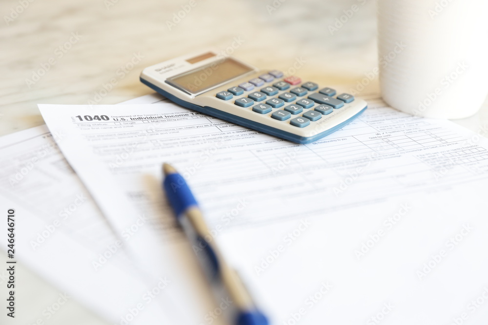 Tax Forms calculator pen paper finance business Tax Forms calculator pen paper finance business